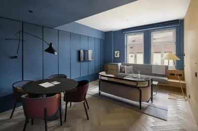 a living room with a couch and a table at Maximilian Hotel in Prague