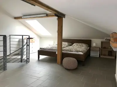 a bedroom with a bed in a attic at Apartmán U babičky in Prague