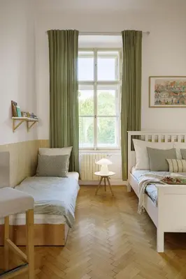 a bedroom with two beds and a window at Wellness apartments Karlín in Prague