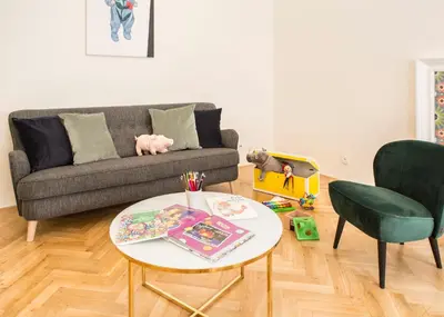 a living room with a couch and a table at Downtown Designer apartment Karlin in Prague