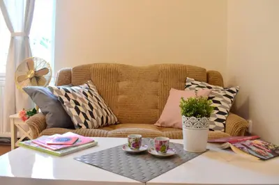 a living room with a couch and a coffee table at BEDROOM residence with SAUNA in Prague