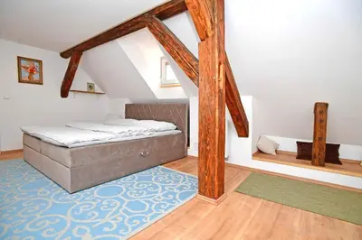 a bedroom with a bed in a attic at Romantic apartment under the Prague castle in Prague