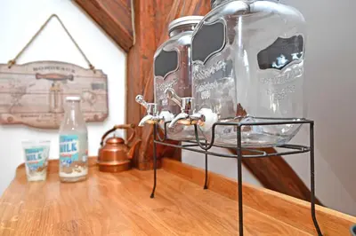 a glass jar on a stand on a wooden table at Romantic apartment under the Prague castle in Prague