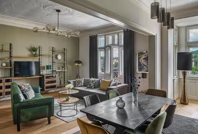 a living room with a couch and a table at MN6 Luxury Suites by Adrez in Prague