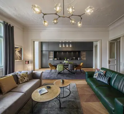 a living room with a couch and a table at MN6 Luxury Suites by Adrez in Prague