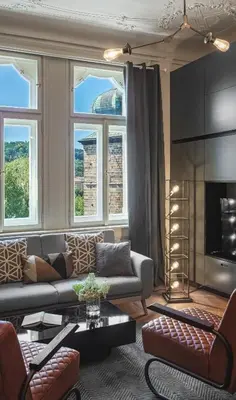 a living room with a couch and a table at MN6 Luxury Suites by Adrez in Prague