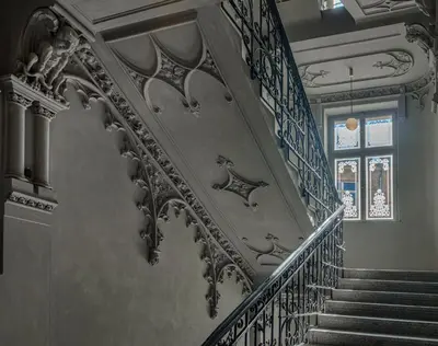 a staircase with blue and white railings and a window at MN6 Luxury Suites by Adrez in Prague