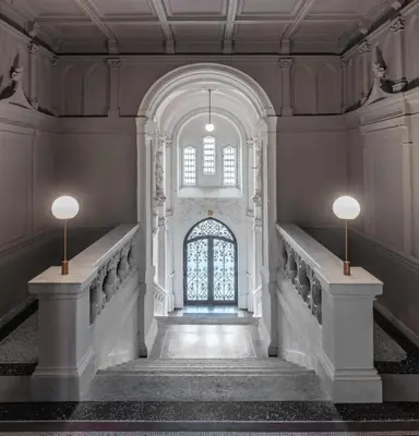 a hallway of a building with a window and stairs at MN6 Luxury Suites by Adrez in Prague