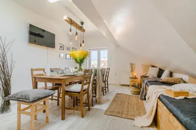 a dining room with a table and chairs at APTs in OLD TOWN PRAGUE by Michal&Friends in Prague