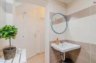 a bathroom with a sink and a mirror at APTs in OLD TOWN PRAGUE by Michal&Friends in Prague