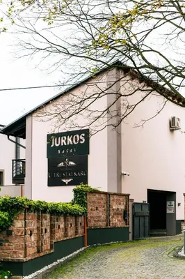 a building with a sign on the side of it at Hotel JURKOS in Příbram