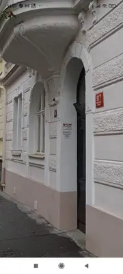 a building with a black door on the side of it at Apartmen -Studio in Prague