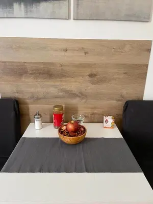 a table with a bowl of apples on it at Apartmen -Studio in Prague
