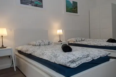 two beds in a room with two lamps on them at Apartment Florenc with 3-bathrooms & bedrooms in Prague