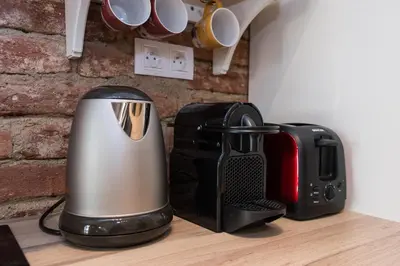 a toaster and a toaster sitting on a counter at Apartment Florenc with 3-bathrooms & bedrooms in Prague