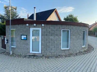 a small brick building on a street at U Vrabčáka in Zlonín