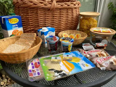 a table topped with baskets of food and bread at U Vrabčáka in Zlonín