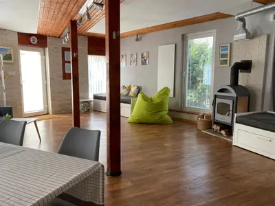 a living room with a wood stove in a room at U Vrabčáka in Zlonín