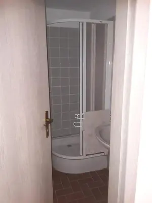 a bathroom with a shower and a toilet and a sink at Apartman V Podbabe in Prague