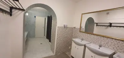 a bathroom with two sinks and a mirror at M-Tourist in Prague