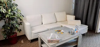 a living room with a white couch and a table at M-Tourist in Prague
