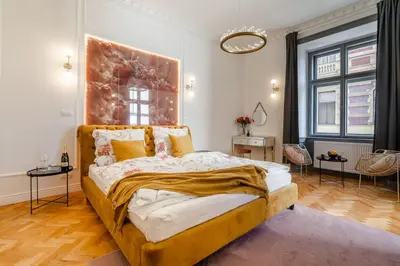 a bedroom with a large bed in a room at Emperor Castle View Suite in Prague