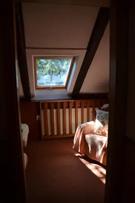 a bedroom with a bed and a window at Pension U akátu in Prague