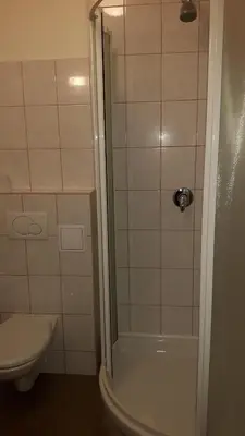a bathroom with a shower and a toilet at Ubytovna Koupaliště in Litoměřice