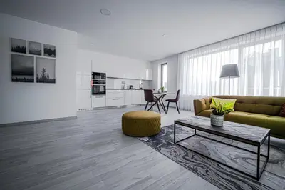 a living room with a couch and a table at Grunt Apartments in Mladá Boleslav