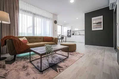 a living room with a couch and a table at Grunt Apartments in Mladá Boleslav