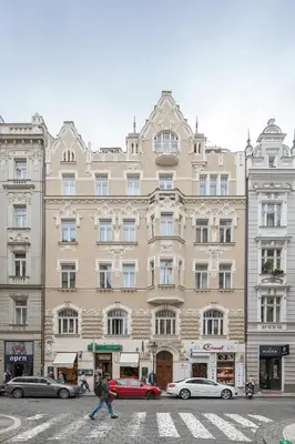 a large building with cars parked in front of it at The BEST place in Prague - Old Town in Prague