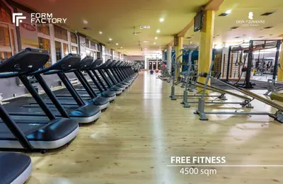 a row of cardio equipment in a gym at Don Giovanni Hotel Prague - Great Hotels of The World in Prague