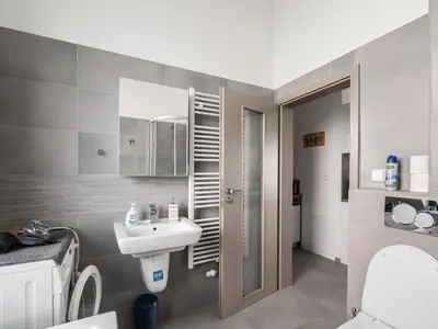 a bathroom with a sink and a toilet at Apartment Lány by Interhome in Lány