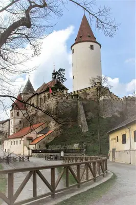 a castle with a tower on top of a hill at Apartment Lány by Interhome in Lány
