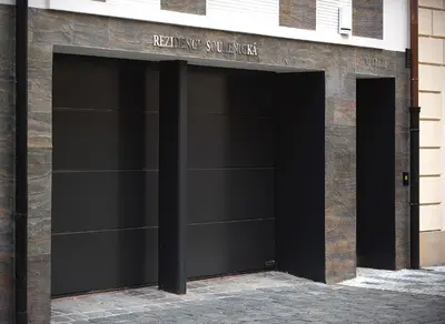 a pair of garage doors on a building at Residence Soukenicka in Prague