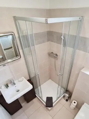 a bathroom with a shower and a sink at Apartmán Praha Břevnov in Prague