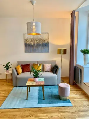 a living room with a couch and a table at Residence Rybna 9- Old Town in Prague