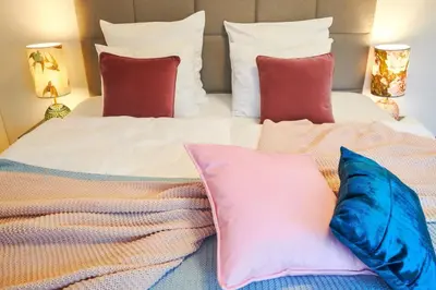 a bedroom with a bed with pillows at Residence Rybna 9- Old Town in Prague