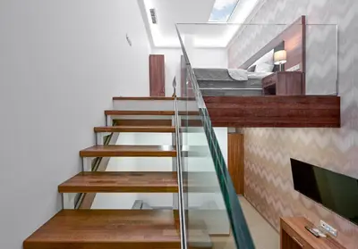 a staircase leading up to a room with a bunk bed at Hotel Prague Star in Prague