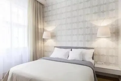 a bedroom with a large white bed and a window at UNIQUE Old Town apartments at Palace Dlouha in Prague