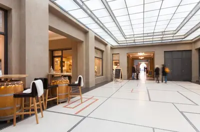 a lobby with people walking in a building at UNIQUE Old Town apartments at Palace Dlouha in Prague