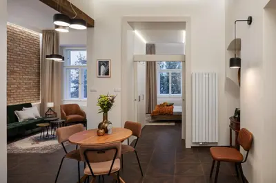 a bedroom with a bed and a window at Prague Days - Elegant Open-plan Apartment in Old Town in Prague