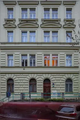 a bedroom with white cabinets and a bed at Prague Days - Elegant Open-plan Apartment in Old Town in Prague