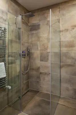 a bathroom with a white sink and a mirror at Prague Days - Elegant Open-plan Apartment in Old Town in Prague