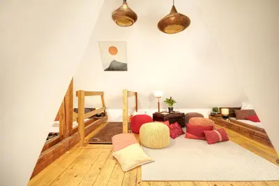 a living room with red chairs and a rug at Charming APT Old Town Prague by Michal&Friends in Prague