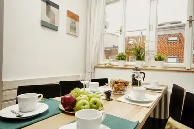 a table with a plate of fruit on it at Charming APT Old Town Prague by Michal&Friends in Prague