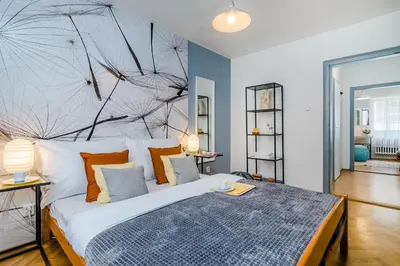 a bedroom with a large bed with a large headboard at Charming APT Old Town Prague by Michal&Friends in Prague