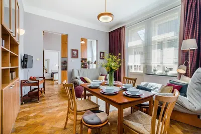 a living room with a table and chairs and a couch at APT near OLD TOWN Prague by Michal&Friends in Prague
