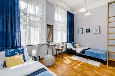 a bedroom with two beds and a desk in it at APT near OLD TOWN Prague by Michal&Friends in Prague