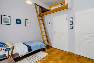 a bedroom with a bunk bed and a ladder at APT near OLD TOWN Prague by Michal&Friends in Prague